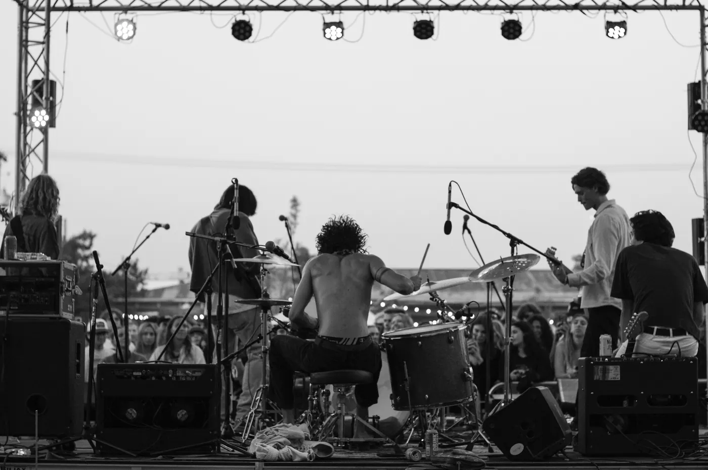 Black and white shot of a band on the outdoor stage